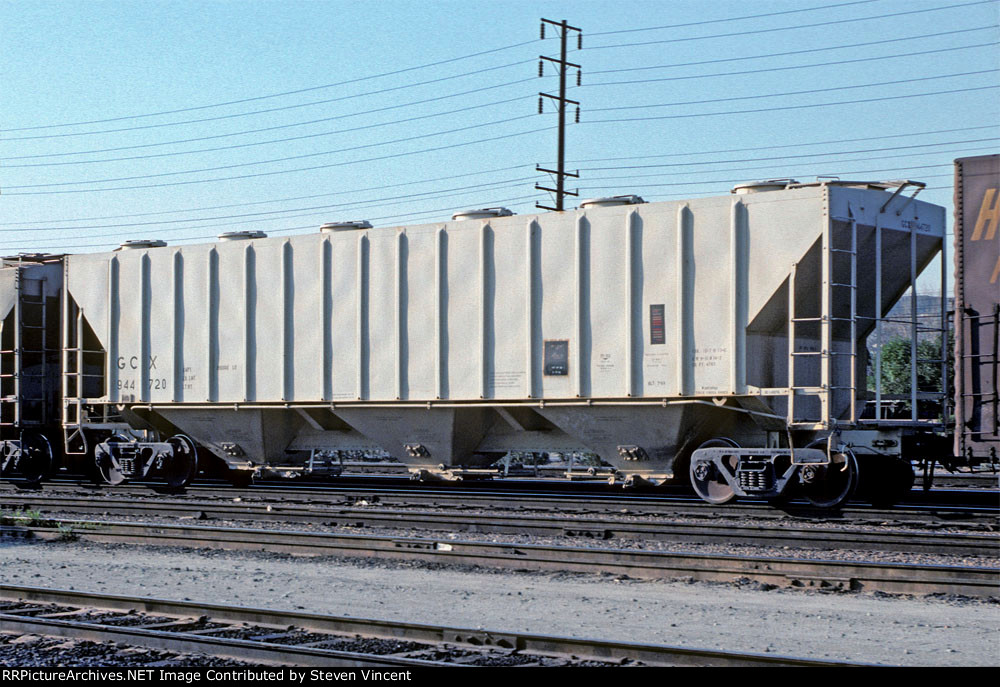 Covered hopper GCX 944720. At time of photo GCX mark listed as "Alltank Equipment Co" a car leasing company for Allied Chemical.